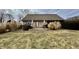 Quaint home with a stone patio, garden and mature landscaping at 1072 S State Road 67, Martinsville, IN 46151