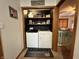 Convenient laundry area with a washer and dryer, a shelf, and cheerful decor for an efficient space at 1072 S State Road 67, Martinsville, IN 46151