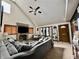 Bright living room with a brick fireplace, large windows, and comfortable, neutral furnishings at 1072 S State Road 67, Martinsville, IN 46151