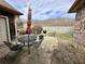 Outdoor patio featuring a table, chairs, grill, and views of the backyard at 1072 S State Road 67, Martinsville, IN 46151