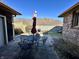 Private patio with wrought-iron furniture, grill and wooded views at 1072 S State Road 67, Martinsville, IN 46151