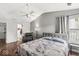 Bright bedroom with ceiling fan, comfortable bed, and a view from the window at 12525 Wolford Dr, Fishers, IN 46038