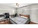 Comfortable bedroom features hardwood floors and a modern ceiling fan at 12525 Wolford Dr, Fishers, IN 46038