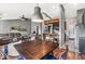 Dining area with hardwood floors, pendant lighting, and open access to the living room and kitchen at 12525 Wolford Dr, Fishers, IN 46038