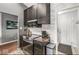Well-equipped kitchen featuring black cabinets, stainless steel appliances, and stylish backsplash at 12525 Wolford Dr, Fishers, IN 46038