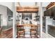 Charming eat-in kitchen with black cabinets, breakfast bar, and open shelving at 12525 Wolford Dr, Fishers, IN 46038