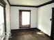Bright bedroom featuring original hardwood floors and natural light at 1258 W 29Th St, Indianapolis, IN 46208