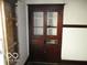 An antique wooden built-in cabinet with glass doors and drawers, adding character to the home at 1258 W 29Th St, Indianapolis, IN 46208