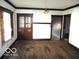 Charming living room showcasing original hardwood floors and decorative built-in shelving at 1258 W 29Th St, Indianapolis, IN 46208