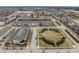 Aerial view of colorful townhomes and manicured green space in a quiet, well-planned community at 12755 Forsyth St, Carmel, IN 46032