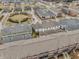 Aerial view of rooftops, lawns, and streetscape including pond in a well-planned community at 12755 Forsyth St, Carmel, IN 46032