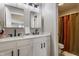 Modern bathroom featuring a double vanity with black faucets and fixtures and a separate toilet and shower area at 12755 Forsyth St, Carmel, IN 46032