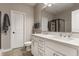 Bathroom featuring a double vanity with white cabinets, marble countertop, and a large mirror at 12755 Forsyth St, Carmel, IN 46032