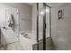 Bathroom showcasing a soaking tub, shower with glass door, and a towel rack at 12755 Forsyth St, Carmel, IN 46032