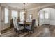 An elegant dining room featuring hardwood floors, a chandelier, and access to other rooms at 12755 Forsyth St, Carmel, IN 46032