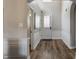 Bright entryway with hardwood floors, decorative trim, and access to adjacent rooms at 12755 Forsyth St, Carmel, IN 46032