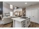 Open-concept view of the modern kitchen, connecting seamlessly to the living and dining areas at 12755 Forsyth St, Carmel, IN 46032