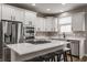 Bright kitchen featuring stainless steel appliances, a center island, and ample counter space at 12755 Forsyth St, Carmel, IN 46032