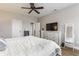 Bright bedroom featuring a ceiling fan, neutral walls, and white trim, creating a clean and relaxing atmosphere at 12755 Forsyth St, Carmel, IN 46032