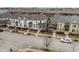 Charming colorful townhomes with inviting front porches and well-maintained street view at 12755 Forsyth St, Carmel, IN 46032