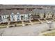 Charming colorful townhomes with inviting front porches and well-maintained street view at 12755 Forsyth St, Carmel, IN 46032