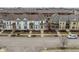 Charming colorful townhomes with inviting front porches and well-maintained street view at 12755 Forsyth St, Carmel, IN 46032