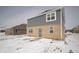 Rear exterior shot with a blend of brick and gray siding, accented by white-framed windows at 1407 Foxtail Ln, Greenwood, IN 46143