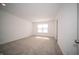 Bedroom featuring a large window, neutral paint, and plush carpeting at 1407 Foxtail Ln, Greenwood, IN 46143