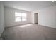 Bedroom with a large window and plush carpeting at 1407 Foxtail Ln, Greenwood, IN 46143