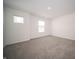 Sunlit bedroom with neutral carpeting and bright windows, creating a cozy atmosphere at 1407 Foxtail Ln, Greenwood, IN 46143