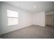 Bright bedroom with window and carpeting, with natural light at 1407 Foxtail Ln, Greenwood, IN 46143