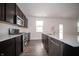 Kitchen with an island, stainless steel appliances and a view of the backyard at 1407 Foxtail Ln, Greenwood, IN 46143