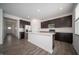 Well-equipped kitchen boasts stainless steel appliances and a large center island at 1407 Foxtail Ln, Greenwood, IN 46143