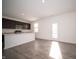 Kitchen with a center island, stainless steel appliances, and view of the backyard at 1407 Foxtail Ln, Greenwood, IN 46143