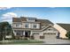 Charming two-story home featuring a three-car garage, well-maintained lawn, and attractive architectural details at 15377 Manderley St, Fishers, IN 46040