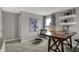 Well-lit home office showcasing a wooden desk, modern chair, stylish decor, and neutral walls at 15377 Manderley St, Fishers, IN 46040