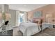 Charming bedroom with plush carpet, a bed dressed in soft pinks, and natural lighting at 16923 Sandhurst Pl, Westfield, IN 46074