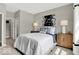 Comfortable bedroom with bright light, neutral walls, carpet floors, and a closet at 16923 Sandhurst Pl, Westfield, IN 46074