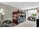 Modern bedroom with a unique bunk bed, bean bag chair, and bright window at 16923 Sandhurst Pl, Westfield, IN 46074