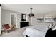 Modern bedroom showcasing stylish decor, a unique lighting fixture and neutral color palette at 16923 Sandhurst Pl, Westfield, IN 46074