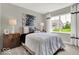 Cozy bedroom with neutral walls, carpet floors, and a large window at 16923 Sandhurst Pl, Westfield, IN 46074