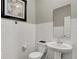 Clean half bath with pedestal sink and subway tile at 16923 Sandhurst Pl, Westfield, IN 46074