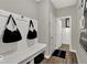 Hallway with hooks, bench, storage and Lennar welcome mat at 16923 Sandhurst Pl, Westfield, IN 46074