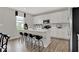 Beautiful kitchen with white cabinets, stainless steel appliances, quartz countertops, and a kitchen island with bar stool seating at 16923 Sandhurst Pl, Westfield, IN 46074