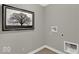Practical laundry room featuring washer and dryer hookups with modern decor at 16923 Sandhurst Pl, Westfield, IN 46074