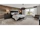 Stylish main bedroom with wood accent wall and ample natural light at 16923 Sandhurst Pl, Westfield, IN 46074