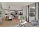 Bright open-concept living space with kitchen, dining area, and comfortable seating near large window at 16960 Sandhurst Pl, Westfield, IN 46074