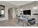 Stylish study featuring modern decor, a neutral color palette, and stairs leading to the upper level at 16960 Sandhurst Pl, Westfield, IN 46074