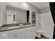 Bright bathroom featuring double sinks, white cabinetry, and a shower-tub combination at 16966 Sandhurst Pl, Westfield, IN 46074