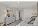 Bedroom showcasing sliding door closet, an adjacent doorway and neutral gray walls, creating a versatile space at 16966 Sandhurst Pl, Westfield, IN 46074